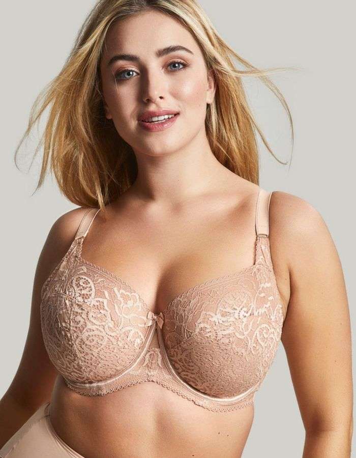 Woman wearing a skin coloured bra.