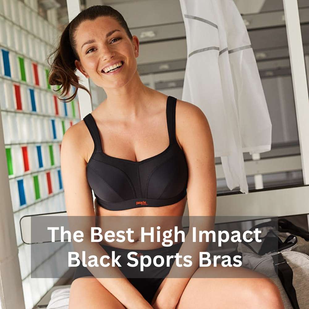 Woman wearing a black sports bra sitting and smiling.